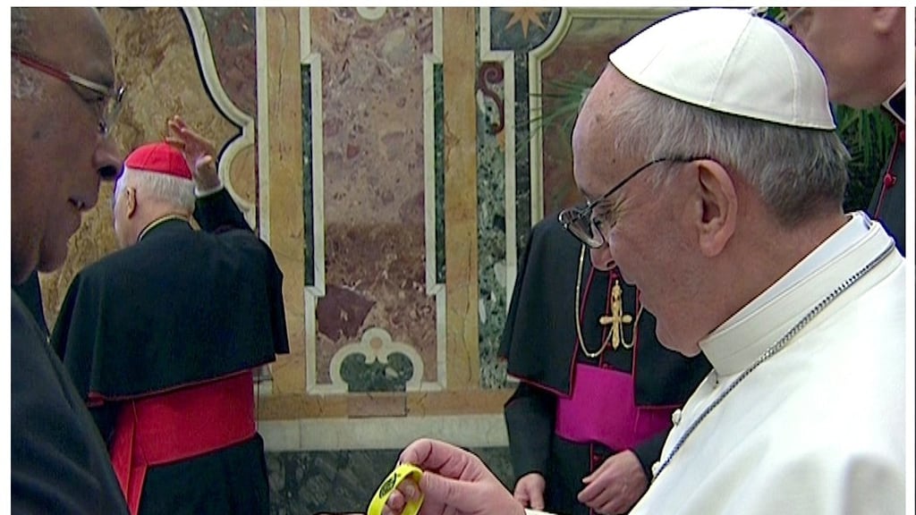 Pope Francis is given a yellow Catholic faith bracelet by Cardinal Wilfrid Fox Napier of South Africa yesterday. Cardinal Napier told the BBC today that paedophilia is a ‘psychological illness’ rather than a criminal condition. Photograph: Reuters