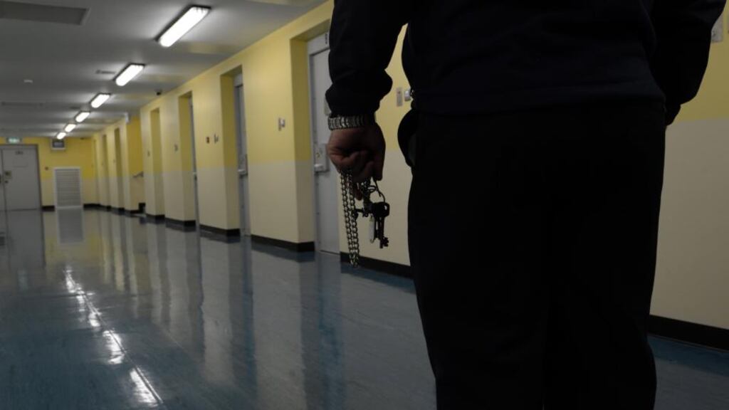 A prison officer in the Mountjoy Prison committal unit where prisoners spend their first night. Photograph: Cyril Byrne/The Irish Times