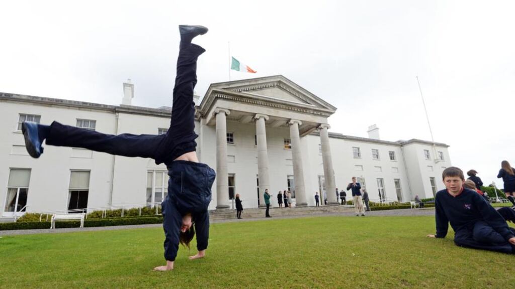 Amelie O’Grady (10), Scoil na Maighdine Mhuire, Newmarket-on-Fergus, Co Clare, performs caretwheels, at a special event for children, as part of the Centenary Programme at Áras an Uachtaráin. Photograph: Eric Luke