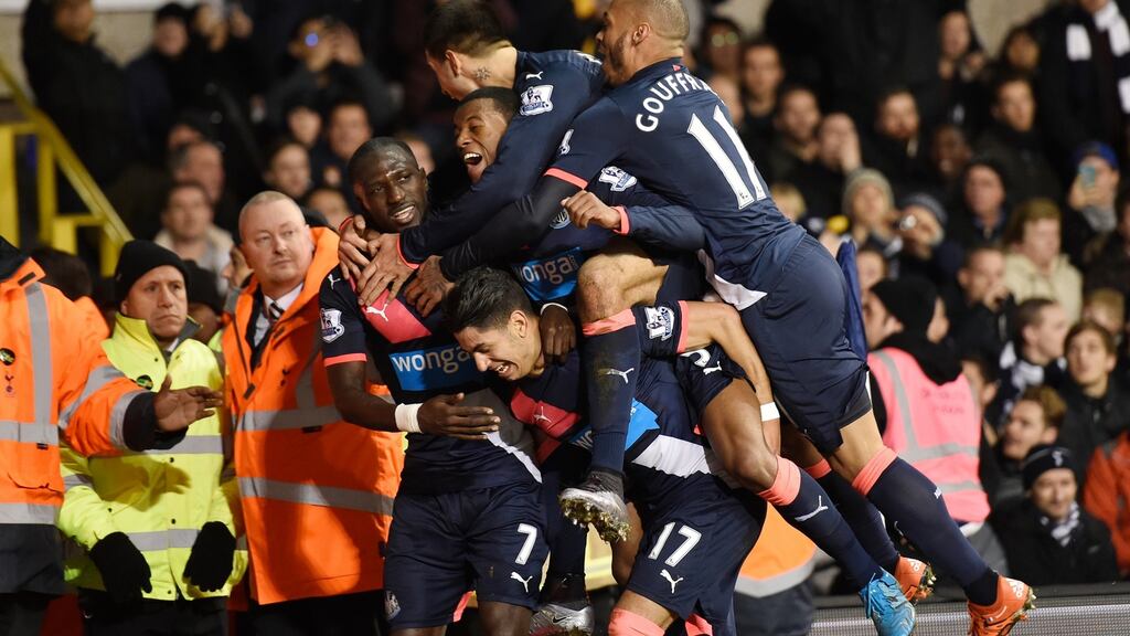 Ayoze Perez  is mobbed by his Newcastle United team-mates after scoring a late winner in the Premier League game against Tottenham Hotspur at White Hart Lane. Photograph: Toby Melville/Reuters/Livepic