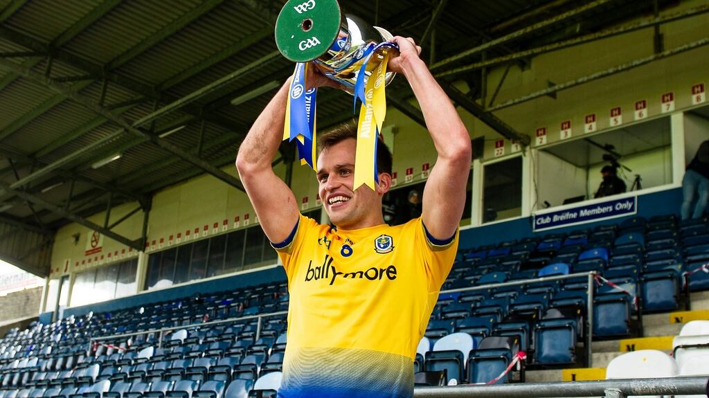 Roscommon’s Enda Smith lifts the Division 2 trophy. Photograph: Inpho