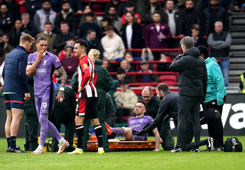 Liverpool's Diogo Jota is placed on to a stretcher after picking up an injury in the Premier League game against Brentford at the Gtech Community Stadium. Photograph: Adam Davy/PA Wire