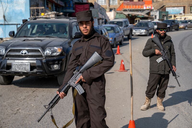 Taliban fighters stand guard in Kabul, Afghanistan. Photograph: Ebrahim Noroozi/AP
