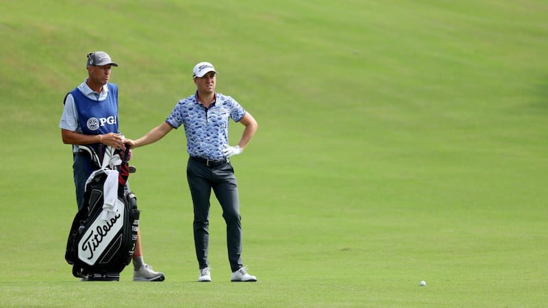 Justin Thomas of the United States and his caddie Jim “Bones” Mackay. Photograph: Richard Heathcote/Getty