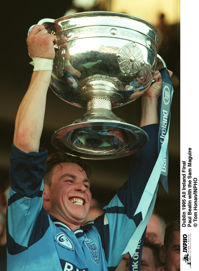 Paul Bealin lifts the Sam Maguire after Dublin's win over Tyrone in the 1995 All-Ireland football final. Photograph: Tom Honan/Inpho