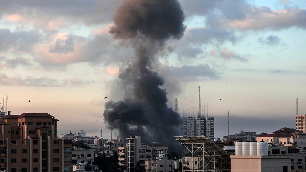 Smoke rises from a building in Gaza City on Tuesday following an Israeli air strike. Photograph: Hosam Salem/The New York Times