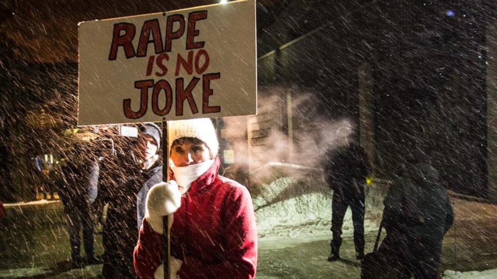 A woman protests as people walk into the Centre In The Square venue in Kitchener, Canada, where Bill Cosby performed on Wednesday evening. Photograph: Mark Blinch/Reuters