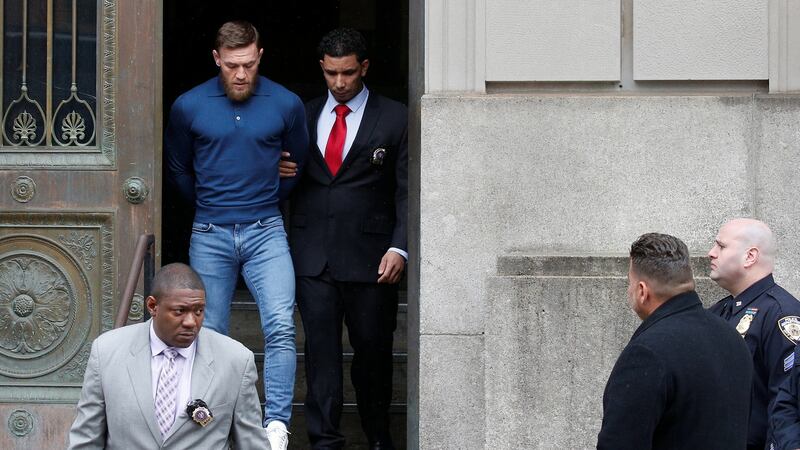 MMA fighter Conor McGregor walks out of the 78th police precinct after charges were laid against him. Photograph: Brendan McDermid/Reuters