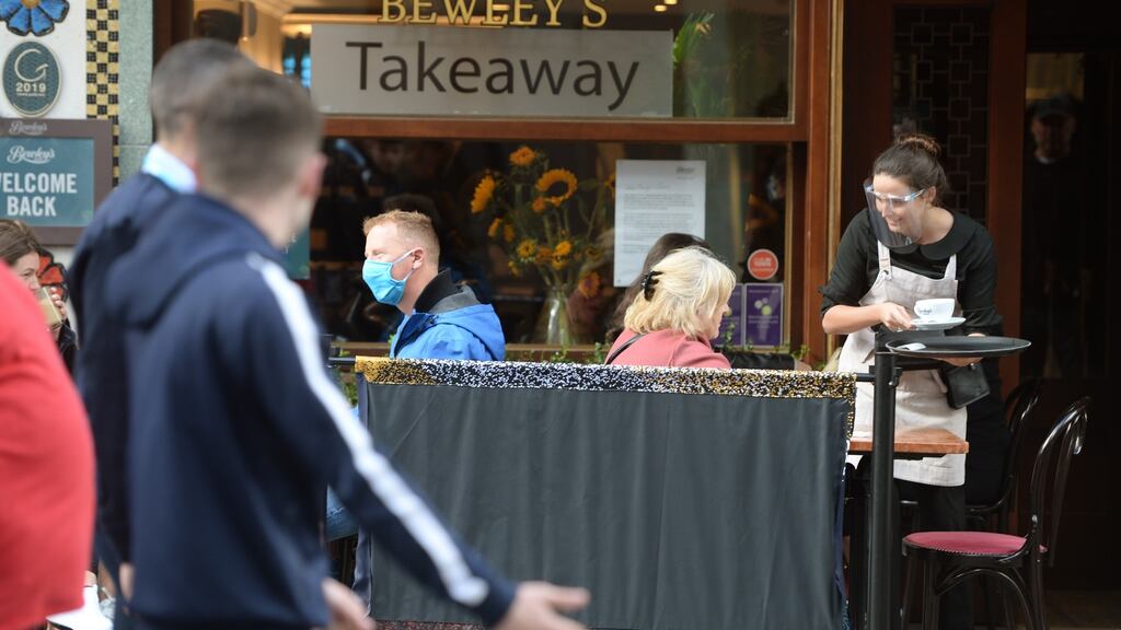 Dining outdoors on Grafton Street in Dublin. “Irish consumers are gradually if unevenly putting the extreme worries of the past couple of years – fuelled first by Brexit and then the coronavirus – behind them.” Photograph: Dara Mac Dónaill