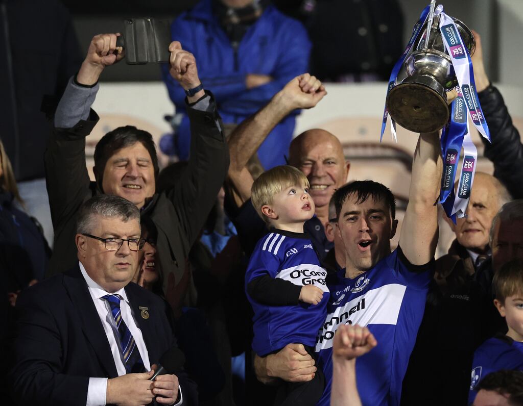 Conor O'Sullivan lifts the trophy as his son Shay watches on following the Munster club SHC victory over Ballygunner at FBD Semple Stadium, Thurles. Photograph: James Crombie/Inpho