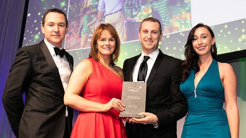 Colin O'Toole, Marketing Manager, Mondelez, presents the Best Entertainment Event Sponsorship award to the Laya Healthcare Team.