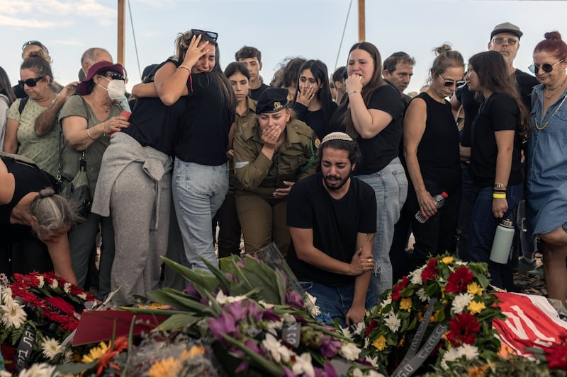 Mourners gather around the five coffins of the Kotz family during their funeral in Gan Yavne, Israel, on October 17th, 10 days after they were killed in the Hamas attack on the kibbutz of Kfar Aza. Photograph: Avishag Shar-Yashuv/New York Times