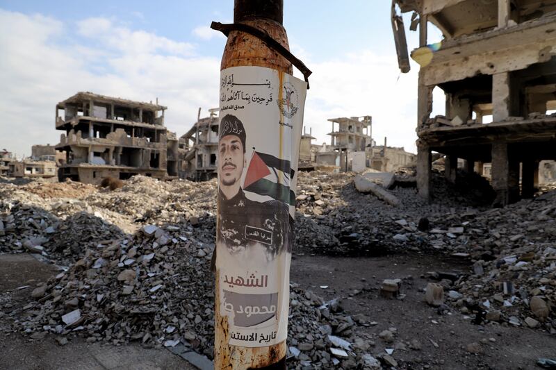 Posters of slain Hamas and Islamic Jihad fighters are plastered on building fronts around Yarmouk. Photograph: Hannah McCarthy