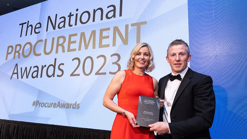 Paul Farrelly, awards judge, presents the most innovative use of technology award to Mary Foran, Permanent TSB and Efficio
