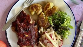 Pork ribs with crushed potatoes and apple sauerkraut slaw