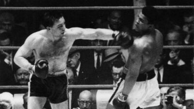 Chuvalo catches Ali with a left hook during their 1966 bout in Toronto. Photo: Doug Griffin/Toronto Star via Getty Images