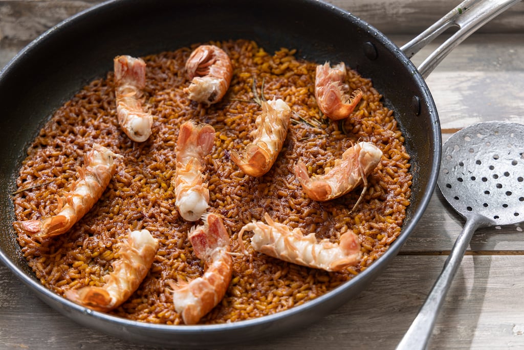 Paella with grilled langoustines. Photograph: Harry weir