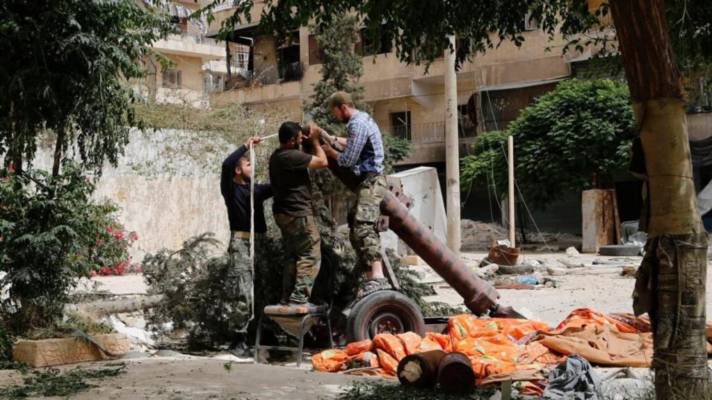 Members of Islamist rebel group Jabhat al-Nusra prepare a home-made mortar in the Bustan al-Qasr neighbourhood of Aleppo. Photograph: Reuters/Hamid Khatib