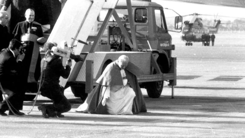 Pope John Paul II arrives into Dublin Airport on Saturday, 29th September, 1979 and kneels to kiss the ground. Photograph: The Irish Times.