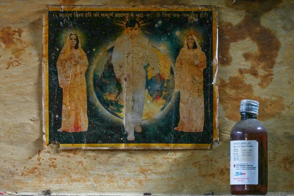 A portrait of former police constable-turned-preacher Bhole Baba is seen pasted on a wall of a victim who died in a stampede during a sermon in Hathras in India's Uttar Pradesh state in July. Photograph: Arun Sankar/AFP via Getty Images