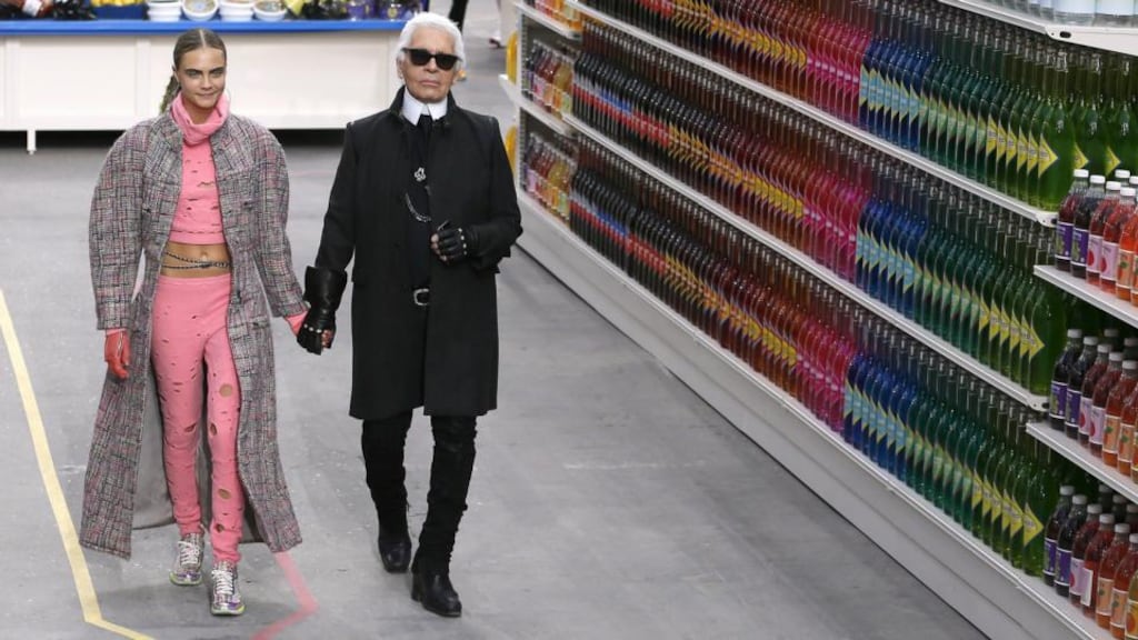 Consumer culture: Karl Lagerfeld with model Cara Delevingne at this season’s Chanel Shopping Centre fashion show, in Paris. Photograph: Patrick Kovarik/AFP/Getty Images