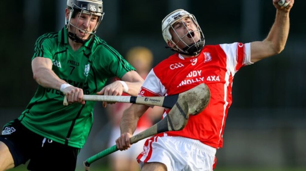 Cuala’s Darragh O’Connell is tackled by Lucan’s Trevor Lee. Photograph: Inpho/Tommy Dickson