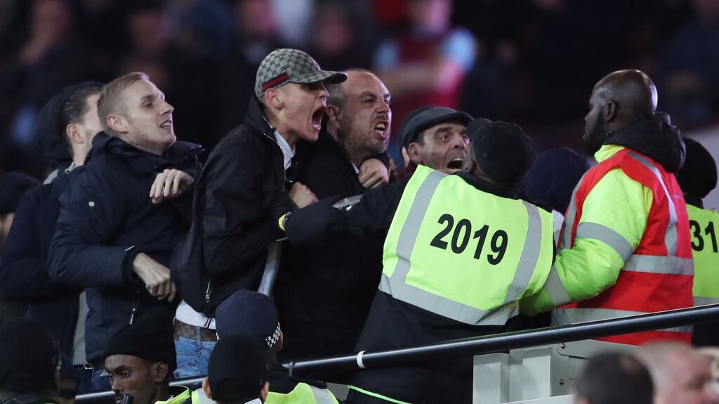 Stewards and police step in as tempers flare in the crowd during the EFL Cup, round of 16 match at the London Stadium. Photo: Nick Potts/PA