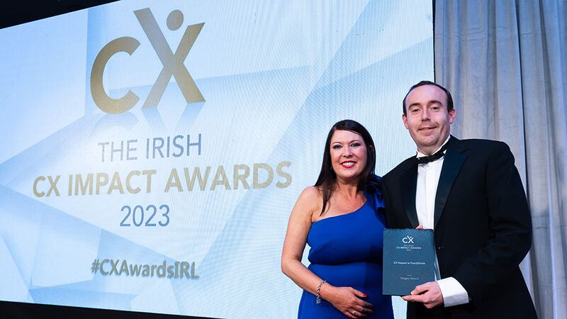 Tara Martin, awards judge, presents the CX impact in food/drink award to Stuart Patterson, Diageo Ireland.