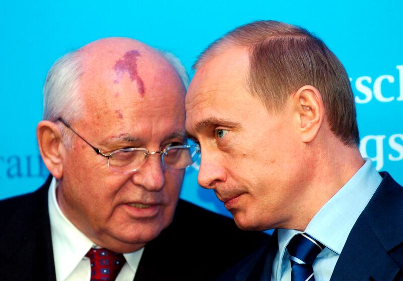 Vladimir Putin with Mikhail Gorbachev in 2004. Photograph: Carsten Rehder/dpa/AP