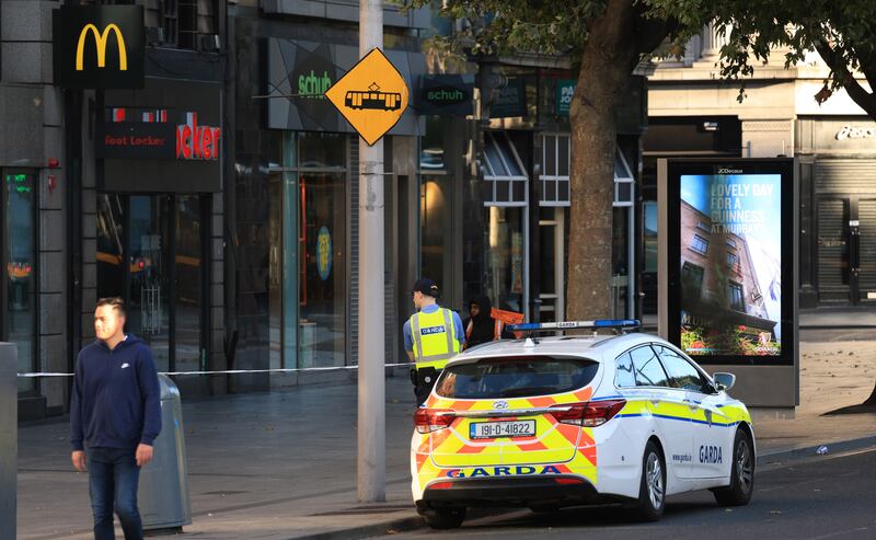 Garda preserved scenes on Westmoreland Street and O'Connell Street. Photograph: Stephen Collins/Collins Photos
