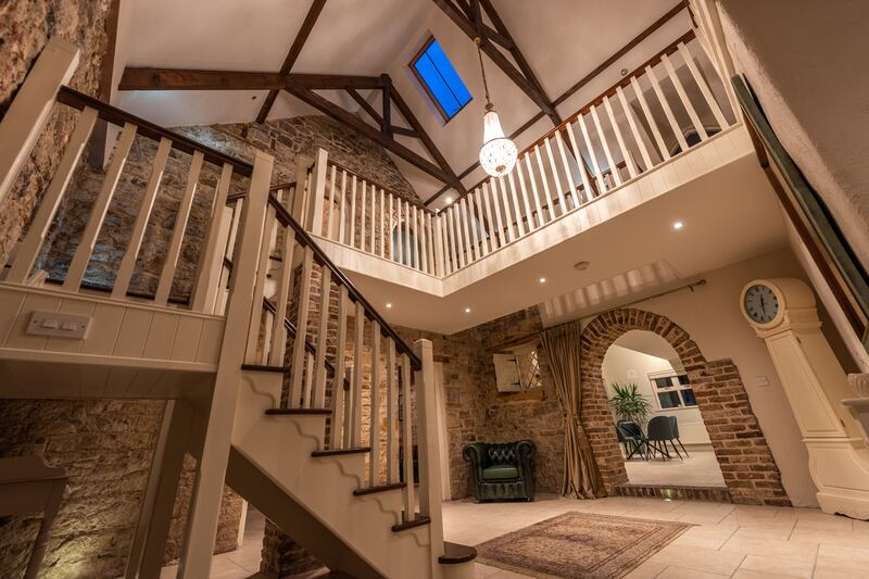 A double height atrium lies inside the front door