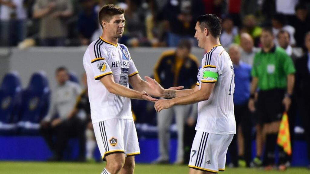 Steven Gerrard congratulates LA Galaxy teammate Robbie Keane on his equaliser against Club America in the International Champions Cup Match in California, a game in which the former Liverpool captain made his debut for the MLS club Photograph: Frederic J. Brown/AFP/Getty Images