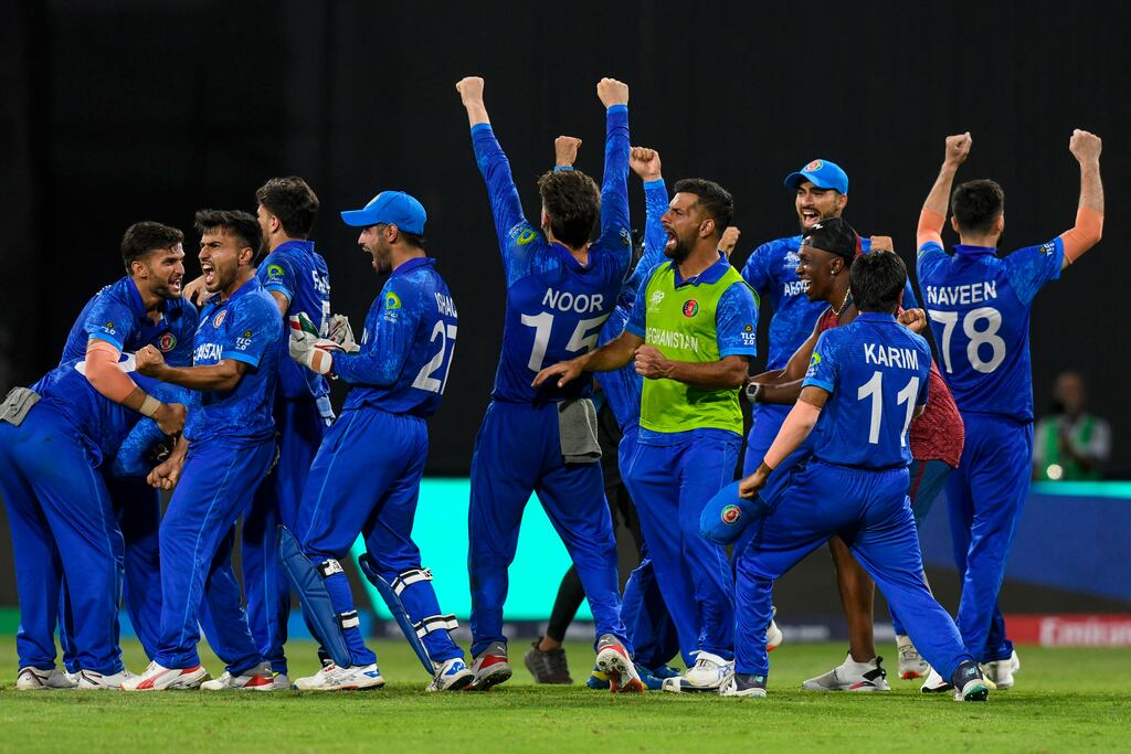 Afghanistan's players celebrate winning their Twenty20 World Cup Super 8 match against Bangladesh in Saint Vincent and the Grenadines to qualify for the semi-finals. Photograph: Randy Brooks/AFP via Getty Images