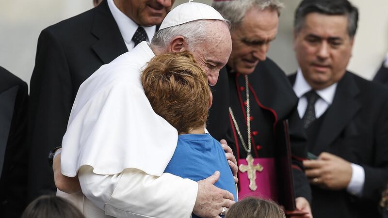 Pope Francis hugs a child during his weekly general audience in St Peter’s Square at the Vatican on August 28th. Photograph: Fabio Frustaci/EPA