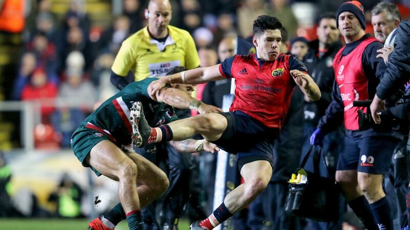 Munster’s Alex Wootton is tackled into tough by Leicester’s Adam Thompstone. Photo: Dan Sheridan/Inpho