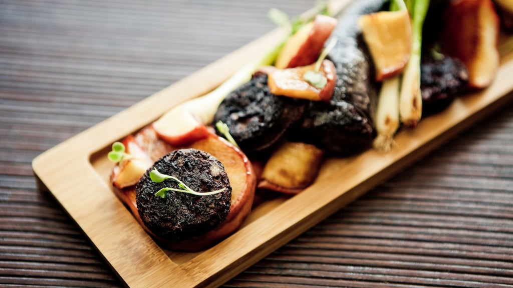 Traditional black pudding is a blend of meat, oatmeal or barley, herbs and spices and the quintessential fresh blood