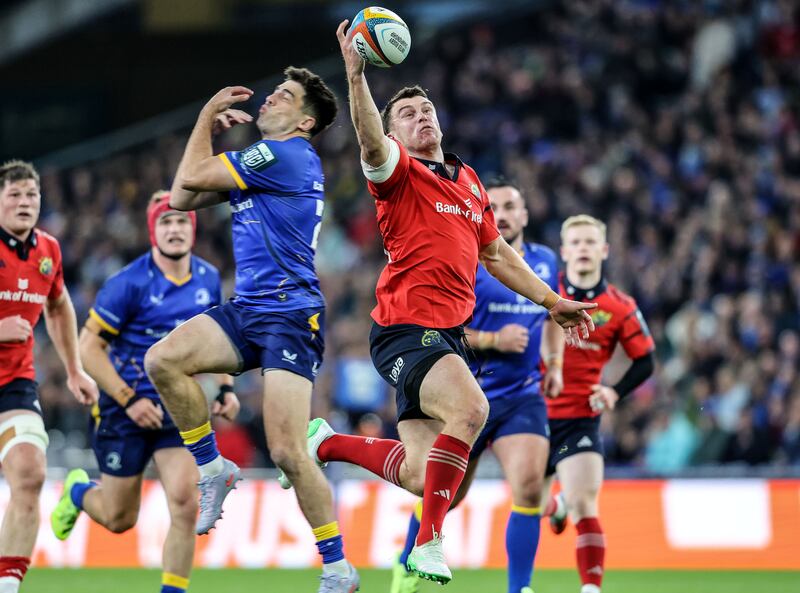 Leinster's Jimmy O'Brien and Munster's Tom Farrell vie to win the ball. Photograph: INPHO/ Dan Sheridan