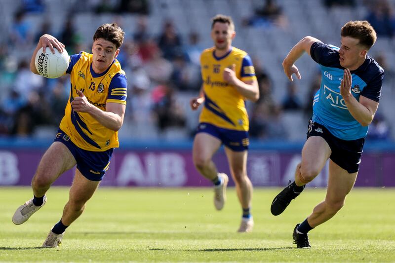 Roscommon's Ben O’Carroll with Daire Newcombe of Dublin. Photograph: Ben Brady/Inpho