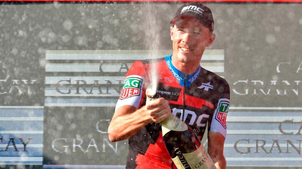 Simon Yates celebrates with the leader’s red jersey after the 16th stage of La Vuelta in Torrelavega, Spain. Photograph: Ander Gillenea/AFP