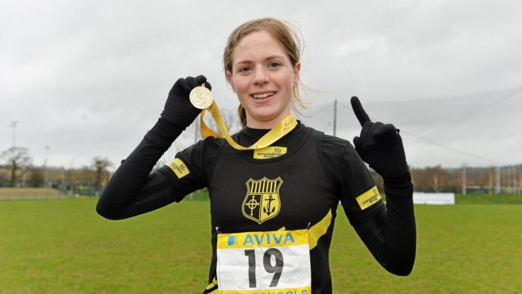 Siofra Cleirigh-Buttner, Colaiste Iosagain, Stillorgan, celebrates with her gold medal after winning the Senior Girls 2500m race during the Aviva All-Ireland Schools Cross Country Championships. Cork IT, Bishopstown, Cork, at the weekend. Photograph: Diarmuid Greene/Sportsfile