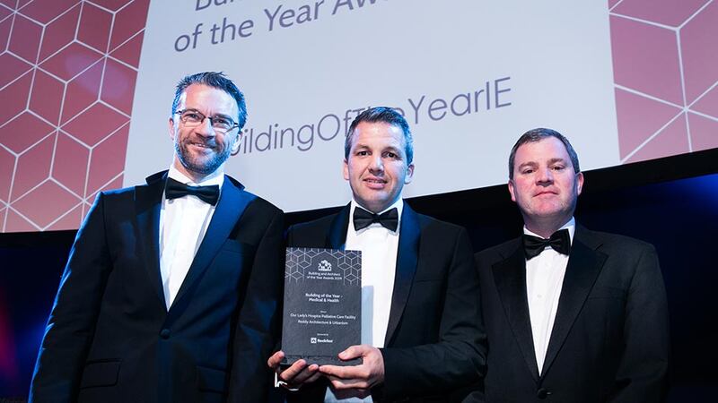 Kevin Clancy, Sales Manager Ireland, Rockfon presents the Building of the Year - Medical & Health award to Paul O’Brien, Reddy Architecture & Urbanism and Tommy Beatty, Our Lady’s Hospice and Care Services.