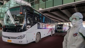 WHO lands in Wuhan as China records first Covid death since May