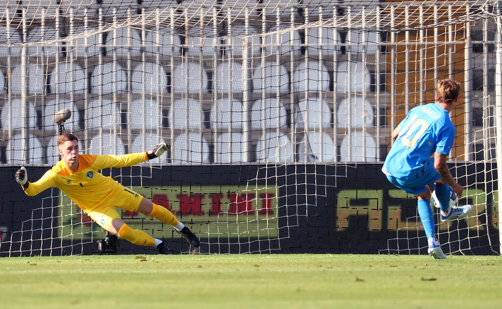 Nicolo Rovella tucks home a penalty kick past Republic of Ireland goalkeeper Brian Mahner to score Italy's first goal at the Stadio Cino e Lillo Del Duca, in Ascoli. Photograph: Giuseppe Fama/Inpho