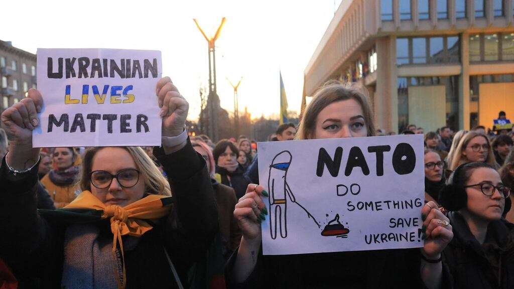 Protesters during a rally against the Russian invasion of Ukraine at Independence Square in front of the Parliament Palace in Vilnius, Lithuania. Photograph: Petras Malukas/AFP/Getty