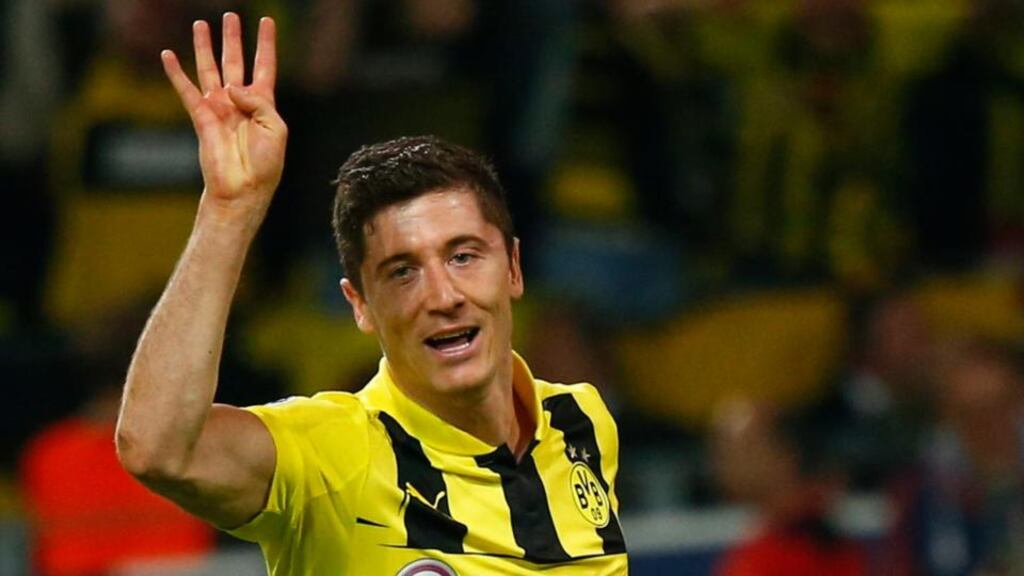 Borussia Dortmund’s Robert Lewandowski gestures as he celebrates after scoring a fourth goal against Real Madrid during their Champions League semi-final first leg soccer match at BVB stadium in Dortmund. Photograph: Kai Pfaffenbach/Reuters