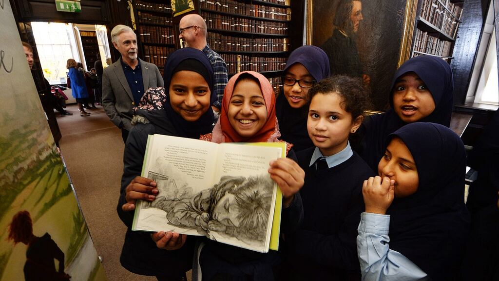 Jumanah Nahari  with  fellow pupils from the North Dublin Muslim School at the launch of “Once Upon a Time” by  Eoin Colfer and illustrator PJ Lynch. Photograph: Cyril Byrne