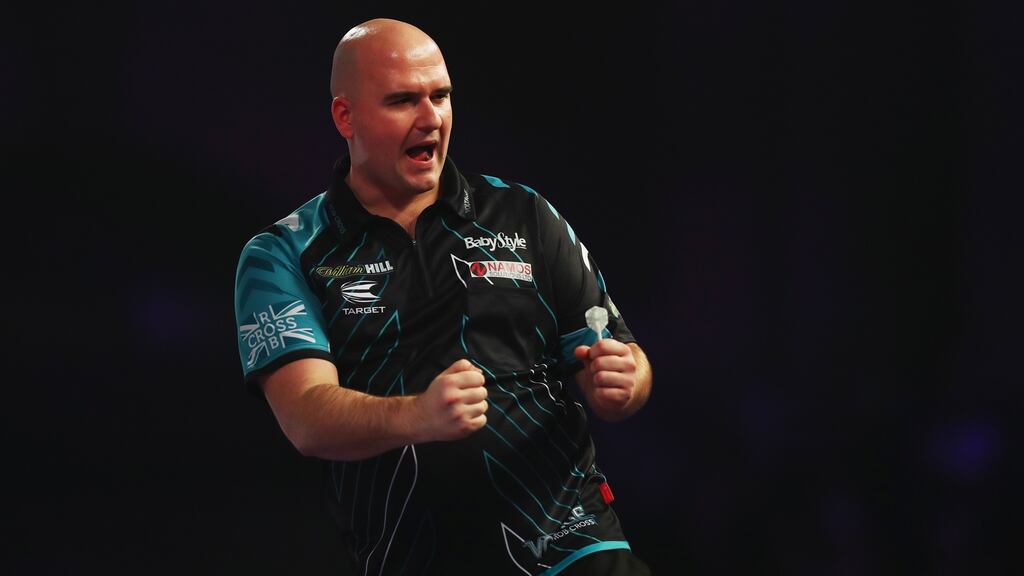 Rob Cross celebrates winning a set during the final of the PDC World Darts Championships  against Phil Taylor  at Alexandra Palace  in London. Photograph:  Naomi Baker/Getty Images