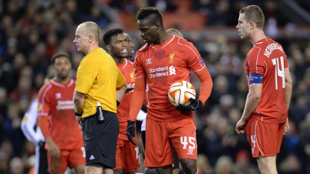 Mario Balotelli takes the ball from Jordan Henderson to take a late penalty as Daniel Sturridge reacts during the Europa League match against Besiktas. Photograph: Oli Scarff/AFP
