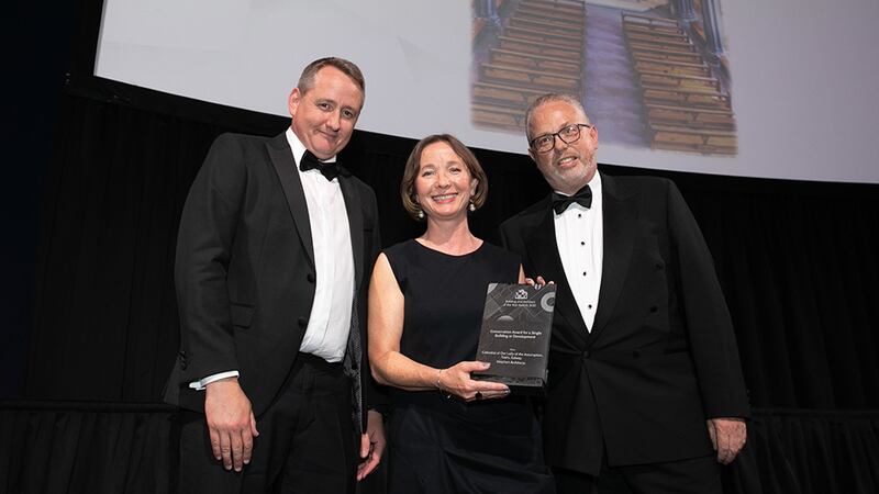 Collette Burns, Awards Judge, presents the Conservation Award for a Single Building or Development award to Brian Glaholm and David Lanigan, Wejchert Architects.