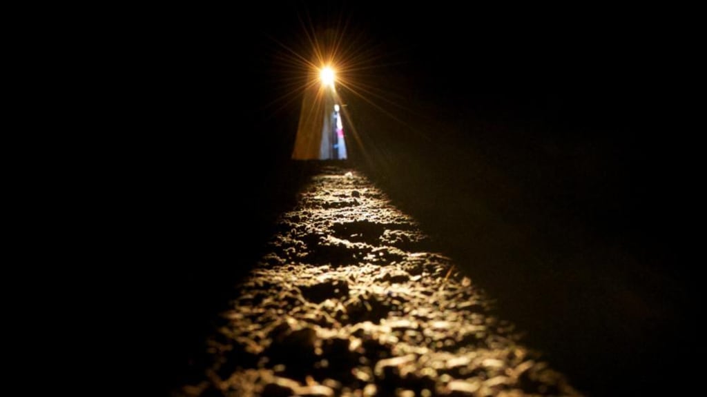 The sun shines along the passage floor into the inner chamber at Newgrange during the Winter Solstice today. The passage tomb in Co. Meath was built over 5,000 years ago. Photograph: Alan Betson/The Irish Times.